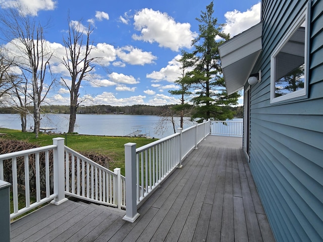 2623 W Dixon Lake Dr, Gaylord, MI 49735 - wooden terrace with a water view and a yard