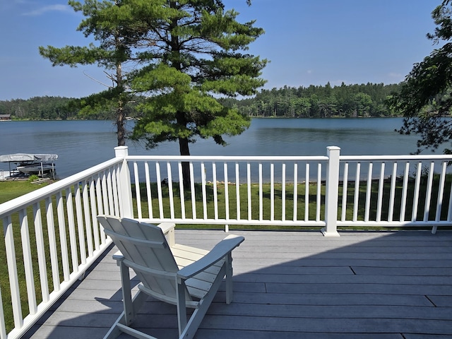 2623 W Dixon Lake Dr, Gaylord, MI 49735 - wooden deck featuring a water view and a wooded view