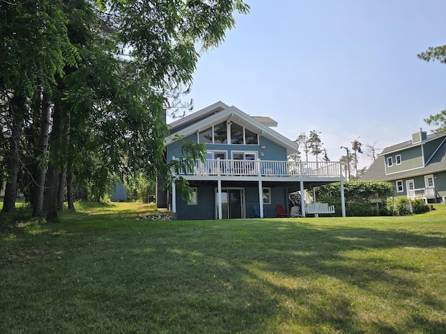 2623 W Dixon Lake Dr, Gaylord, MI 49735 - back of house with a wooden deck and a lawn
