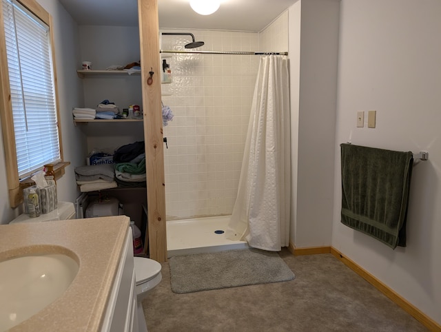 20563 S M32, Hillman, MI 49746 - full bath with a stall shower, toilet, vanity, and baseboards