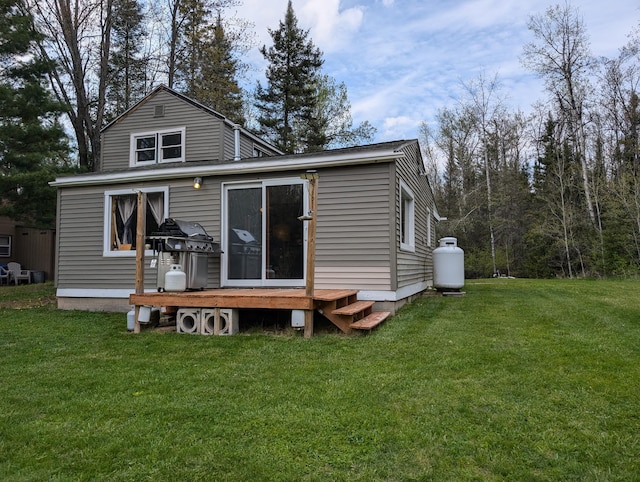 20563 S M32, Hillman, MI 49746 - back of house with a lawn and a wooden deck