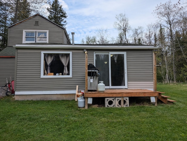 20563 S M32, Hillman, MI 49746 - rear view of house featuring a deck, a yard, and roof with shingles