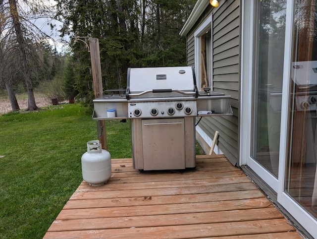 20563 S M32, Hillman, MI 49746 - deck with a lawn and a grill