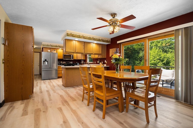 11758 Woodview Trl, Gaylord, MI 49735 - dining area with light wood-type flooring and ceiling fan