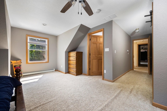 11758 Woodview Trl, Gaylord, MI 49735 - unfurnished bedroom with baseboard heating, carpet flooring, and a ceiling fan