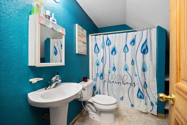 11758 Woodview Trl, Gaylord, MI 49735 - full bathroom featuring a textured ceiling, lofted ceiling, toilet, baseboards, and tile patterned flooring