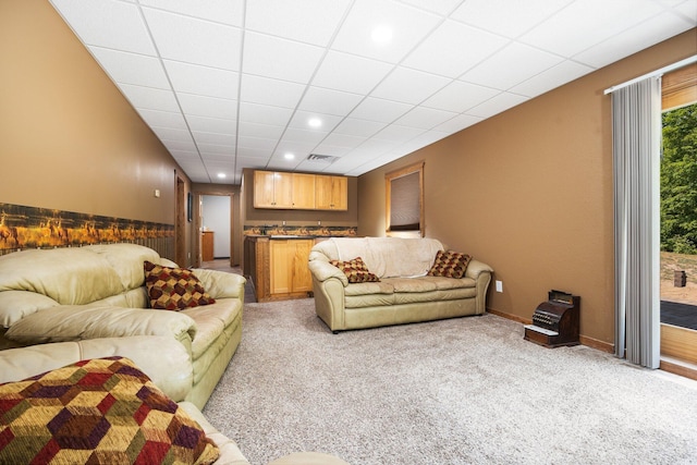 11758 Woodview Trl, Gaylord, MI 49735 - living area featuring light colored carpet, wet bar, wainscoting, and recessed lighting