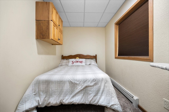 11758 Woodview Trl, Gaylord, MI 49735 - bedroom featuring a baseboard radiator and a drop ceiling