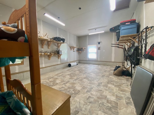 11758 Woodview Trl, Gaylord, MI 49735 - below grade area with stone finish floors