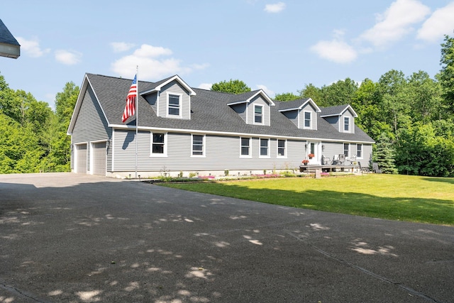 11758 Woodview Trl, Gaylord, MI 49735 - cape cod house with a garage, a front yard, a shingled roof, and asphalt driveway