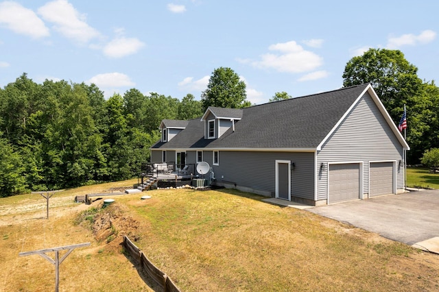 11758 Woodview Trl, Gaylord, MI 49735 - view of front facade featuring a front yard, a deck, and roof with shingles