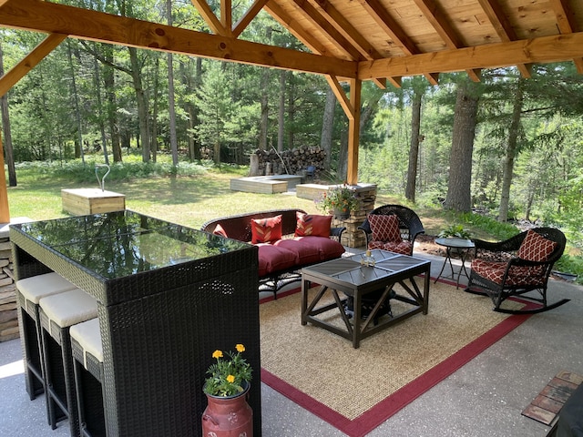 6475 W Legner Trl, Grayling, MI 49738 - view of patio / terrace with outdoor dining area, an outdoor living space, and a gazebo