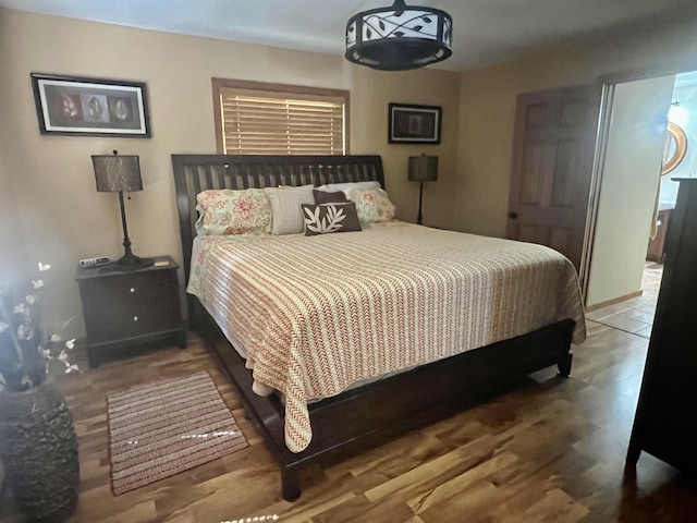 6475 W Legner Trl, Grayling, MI 49738 - bedroom with wood finished floors