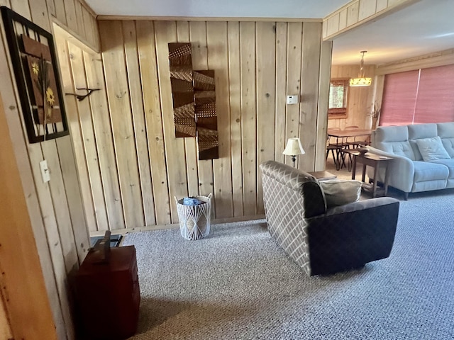 6475 W Legner Trl, Grayling, MI 49738 - carpeted living area featuring wood walls and a chandelier
