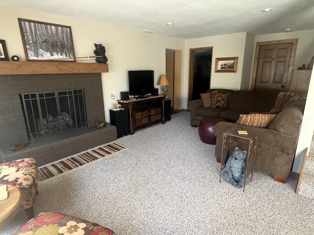 6475 W Legner Trl, Grayling, MI 49738 - carpeted living room with a tiled fireplace