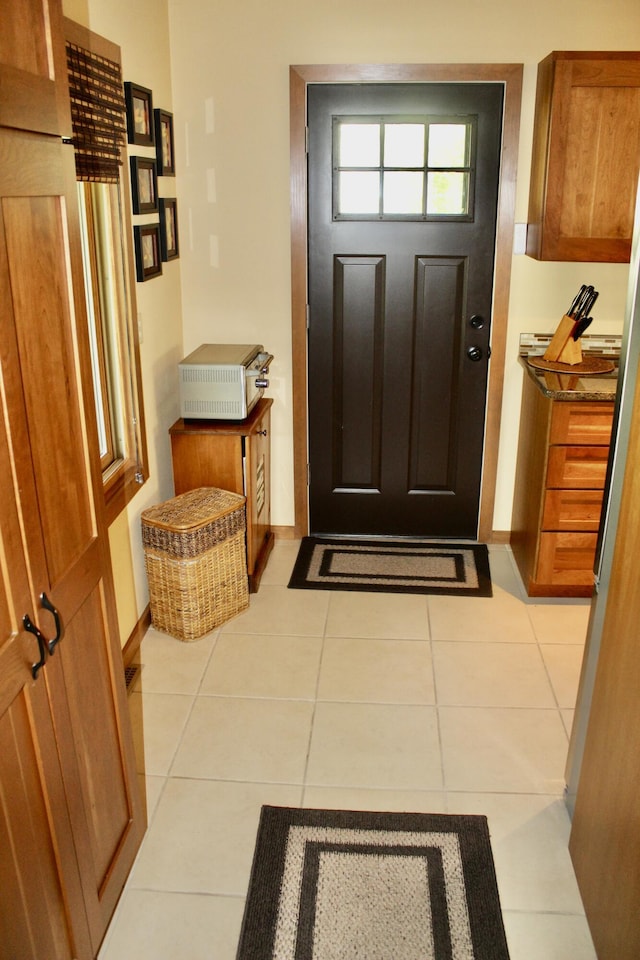 6475 W Legner Trl, Grayling, MI 49738 - entryway with light tile patterned floors and baseboards