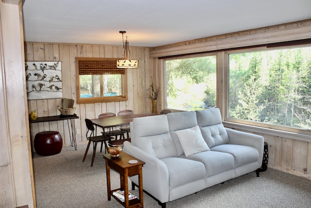 6475 W Legner Trl, Grayling, MI 49738 - living room featuring wooden walls and carpet flooring