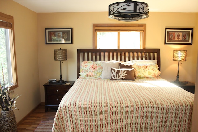 6475 W Legner Trl, Grayling, MI 49738 - bedroom with dark wood-style flooring and baseboards