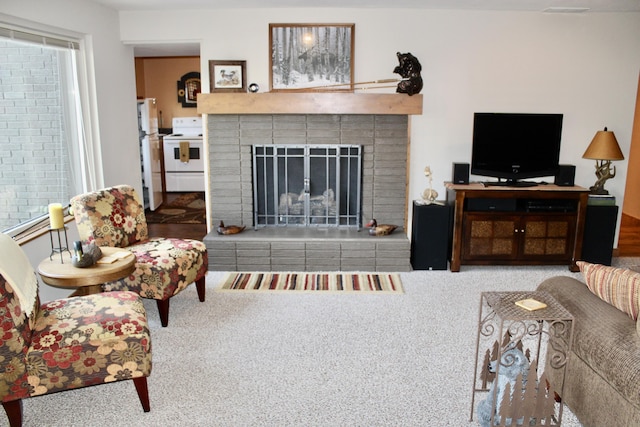 6475 W Legner Trl, Grayling, MI 49738 - living area with carpet and a brick fireplace
