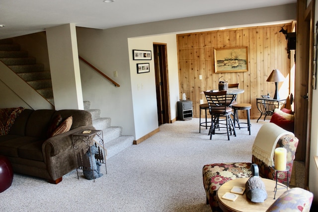6475 W Legner Trl, Grayling, MI 49738 - living room featuring stairs, carpet floors, and baseboards
