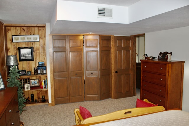 6475 W Legner Trl, Grayling, MI 49738 - bedroom with carpet floors, a closet, and wood walls