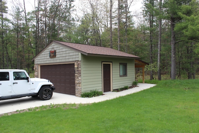 6475 W Legner Trl, Grayling, MI 49738 - detached garage featuring a wooded view
