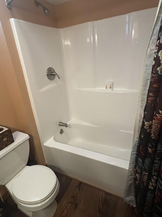 6475 W Legner Trl, Grayling, MI 49738 - full bath with shower / bath combination with curtain, toilet, and wood finished floors