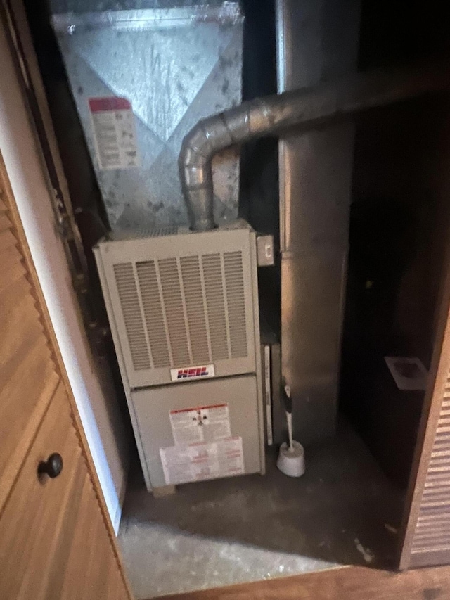 6475 W Legner Trl, Grayling, MI 49738 - utility room with heating unit