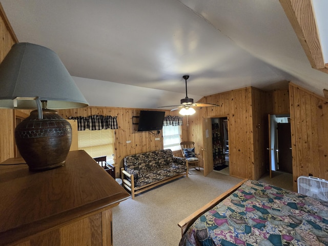7912 Millecoquin Trl, Gaylord, MI 49735 - bedroom with lofted ceiling, carpet, wood walls, and ceiling fan