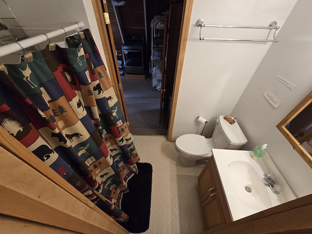 7912 Millecoquin Trl, Gaylord, MI 49735 - bathroom with vanity, toilet, tile patterned floors, and a shower with curtain