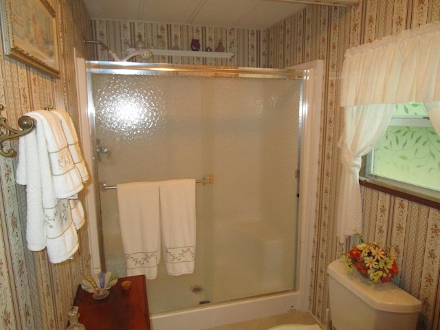 541 Ranch Rd, Indian River, MI 49749 - bathroom featuring wallpapered walls, a shower stall, and toilet