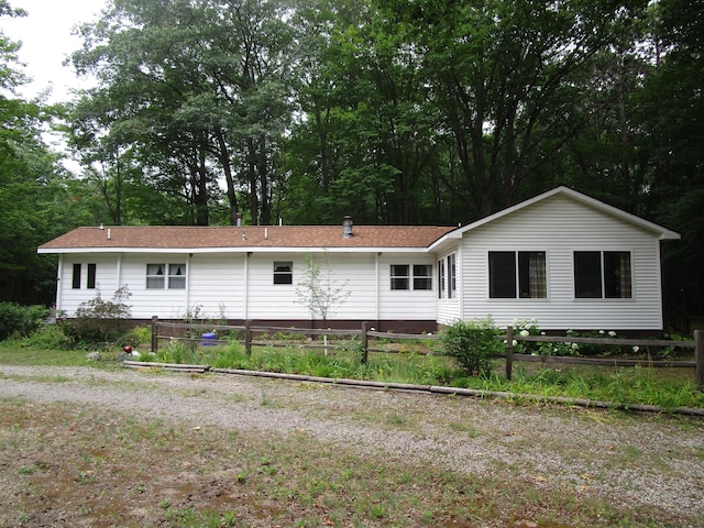 541 Ranch Rd, Indian River, MI 49749 - rear view of house with fence