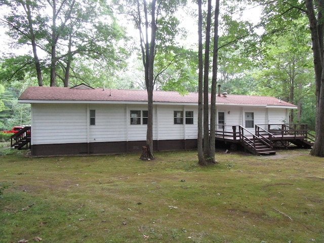 541 Ranch Rd, Indian River, MI 49749 - back of property featuring a deck and a yard
