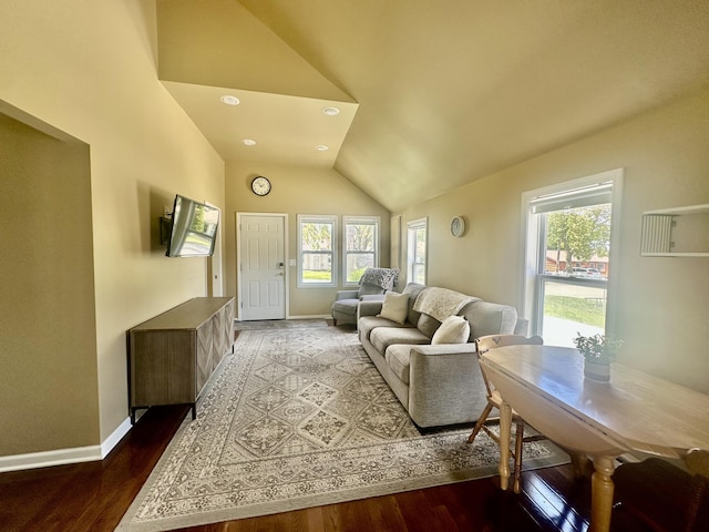 living room featuring vaulted ceiling, plenty of natural light, baseboards, wood finished floors, and recessed lighting