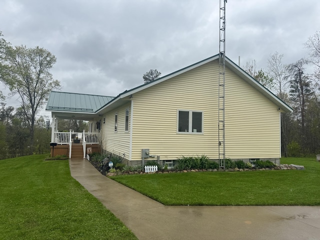 870 Dalton Dr, Rose City, MI 48654 - view of side of home with a yard and covered porch