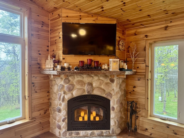 870 Dalton Dr, Rose City, MI 48654 - detailed view of wood walls, a fireplace, and wood finished floors