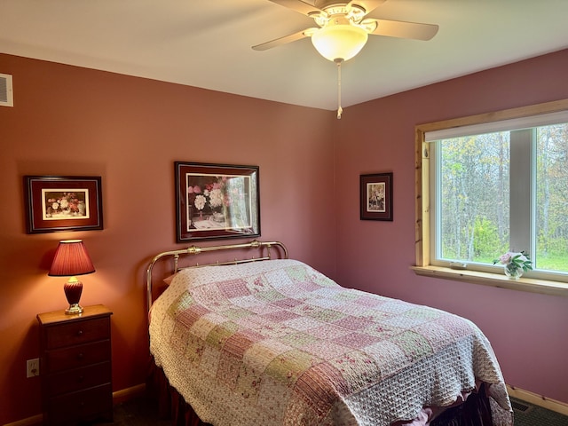 870 Dalton Dr, Rose City, MI 48654 - bedroom with baseboards and ceiling fan