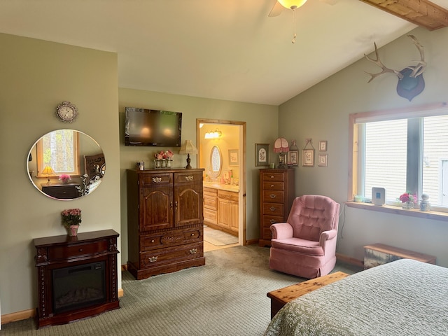 870 Dalton Dr, Rose City, MI 48654 - bedroom featuring light carpet, ensuite bath, lofted ceiling, ceiling fan, and baseboards