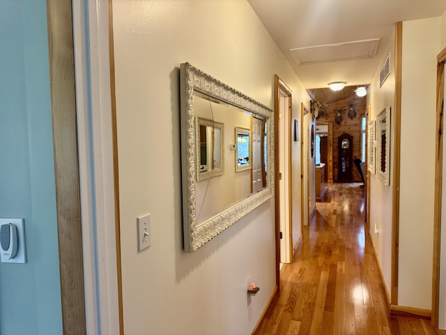 870 Dalton Dr, Rose City, MI 48654 - hall featuring light wood finished floors and attic access