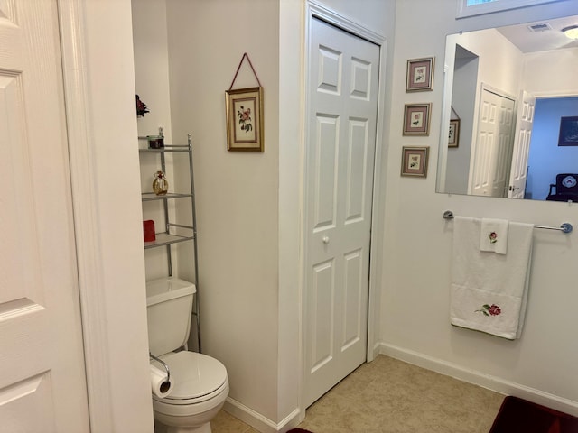 870 Dalton Dr, Rose City, MI 48654 - bathroom featuring baseboards and toilet