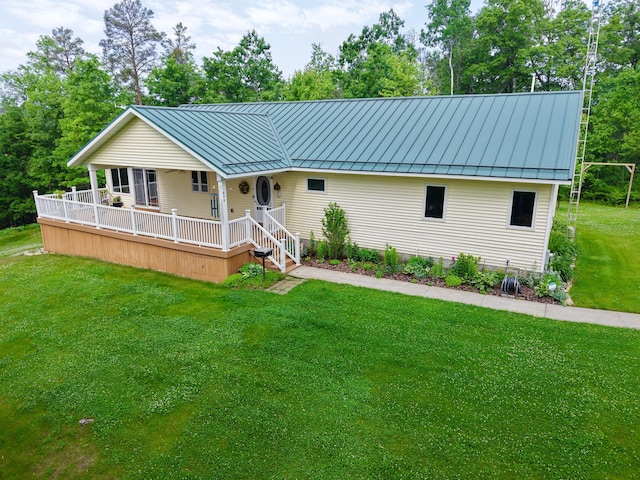 870 Dalton Dr, Rose City, MI 48654 - ranch-style home featuring a standing seam roof, a front lawn, and a metal roof