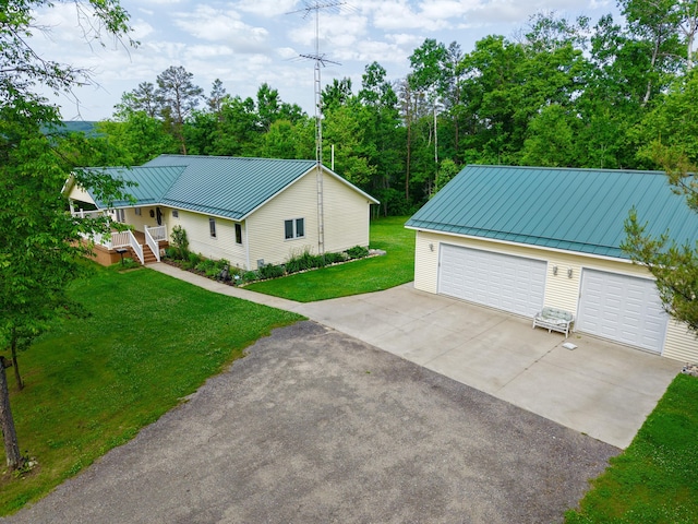 870 Dalton Dr, Rose City, MI 48654 - detached garage featuring driveway