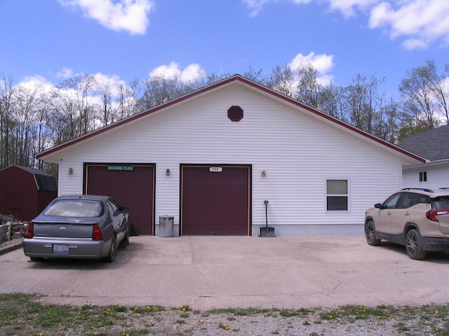 5198 Troopers Trl, Frederic, MI 49733 - view of home's exterior with a garage and driveway