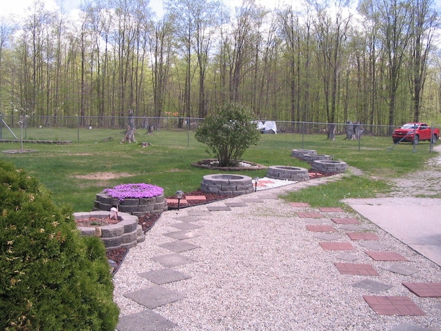 5198 Troopers Trl, Frederic, MI 49733 - view of yard with a fire pit
