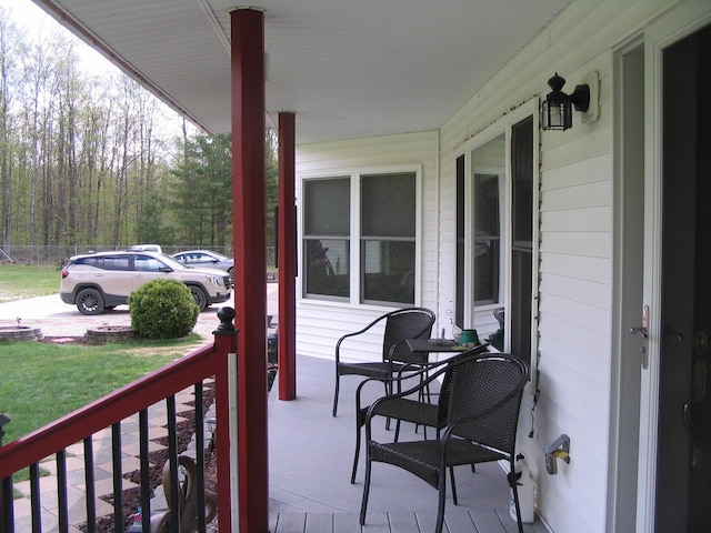 5198 Troopers Trl, Frederic, MI 49733 - wooden terrace with a porch