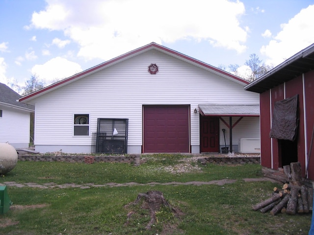 5198 Troopers Trl, Frederic, MI 49733 - view of property exterior with a lawn and an attached garage