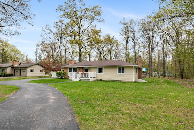 6727 Fisher Woods Rd, Indian River, MI 49749 - ranch-style home featuring a chimney, a front lawn, and a porch