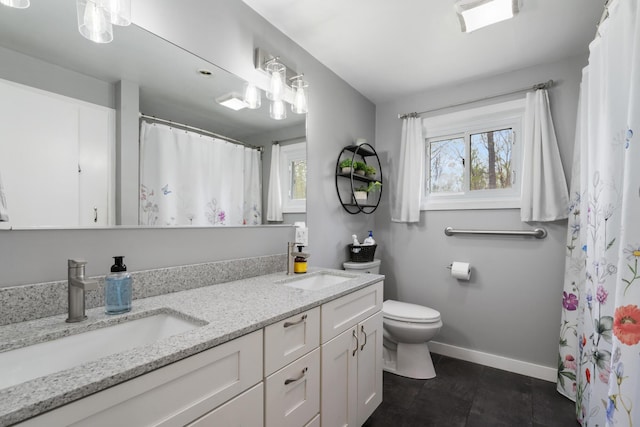 6727 Fisher Woods Rd, Indian River, MI 49749 - bathroom featuring toilet, double vanity, baseboards, tile patterned floors, and a shower with shower curtain