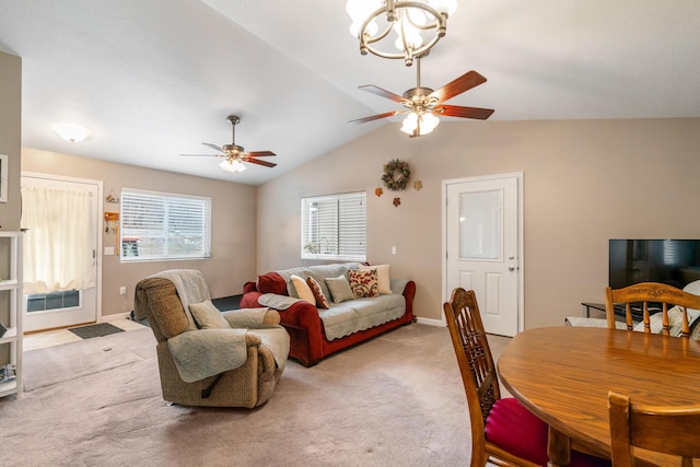 2286 Maxwell Rd, Petoskey, MI 49770 - dining space with ceiling fan, light colored carpet, vaulted ceiling, baseboards, and a chandelier