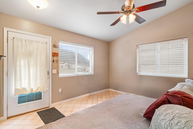 2286 Maxwell Rd, Petoskey, MI 49770 - bedroom featuring tile patterned flooring, lofted ceiling, baseboards, and a ceiling fan